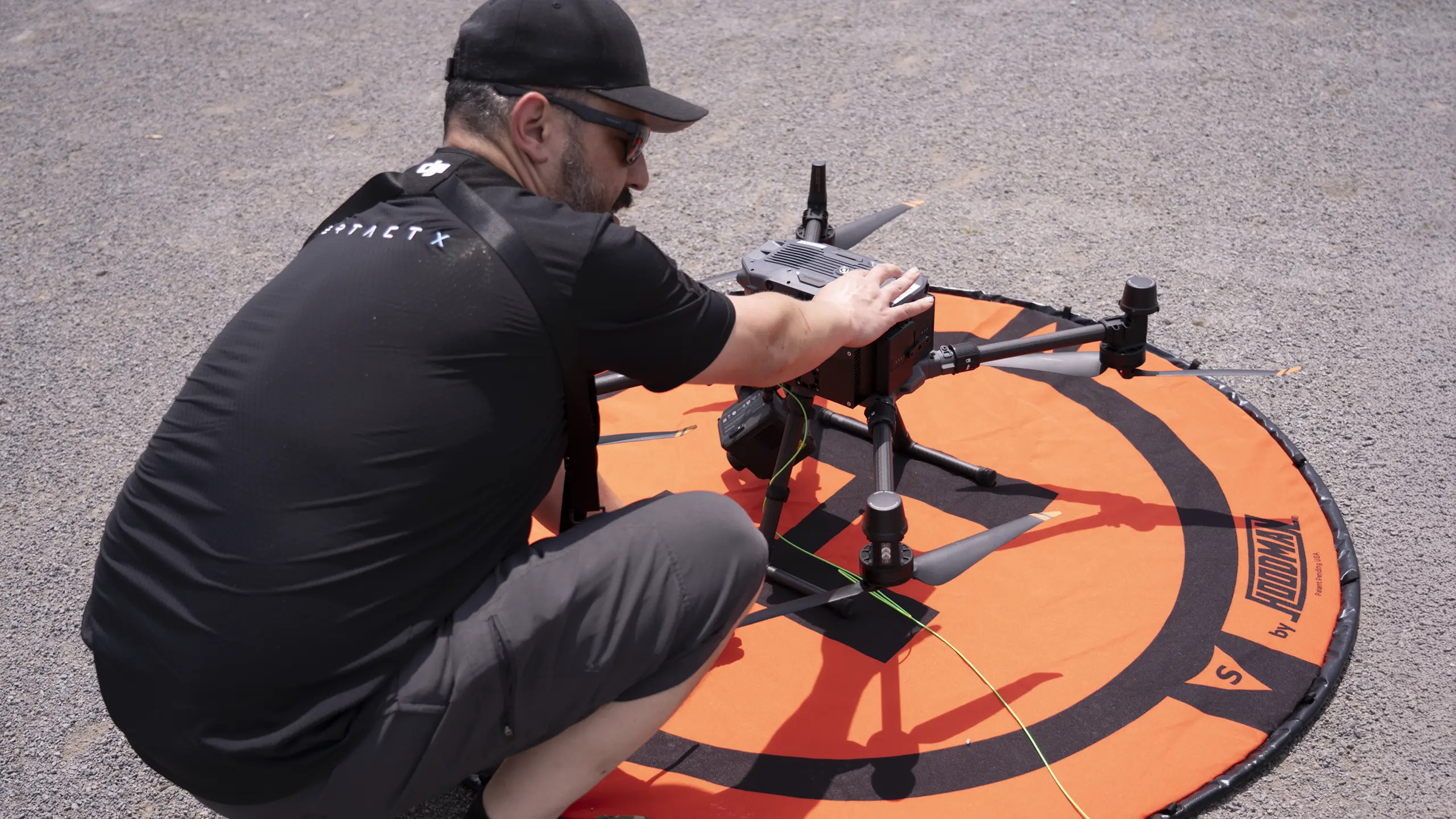 Tethered drone providing aerial coverage